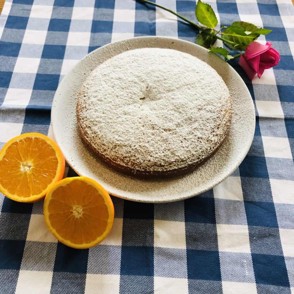 Freshly baked Orange and poppyseed cake dusted with icing sugar