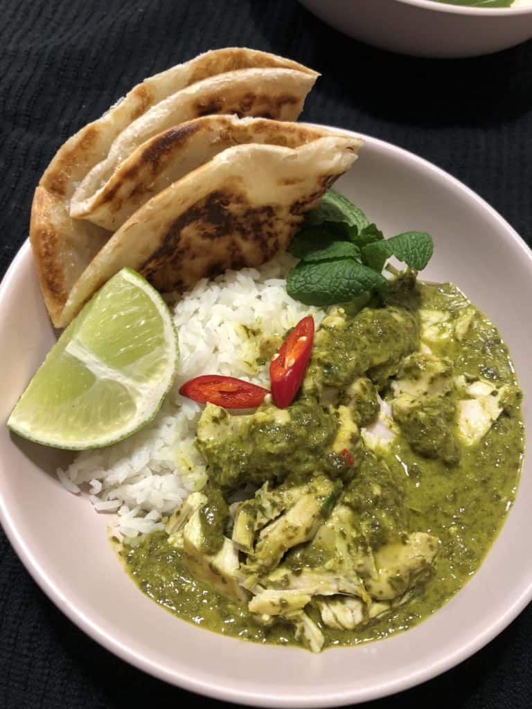 Healthy Thai Green chicken curry with rice, roti and lime 