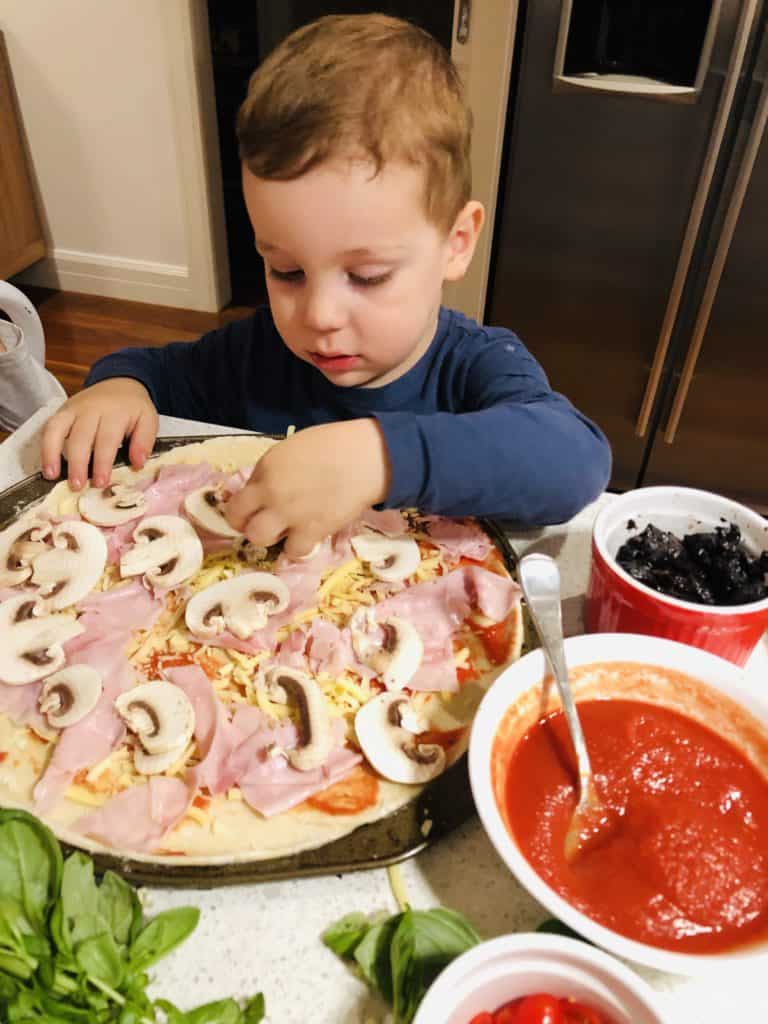 Get the kids involved with making pizzas 