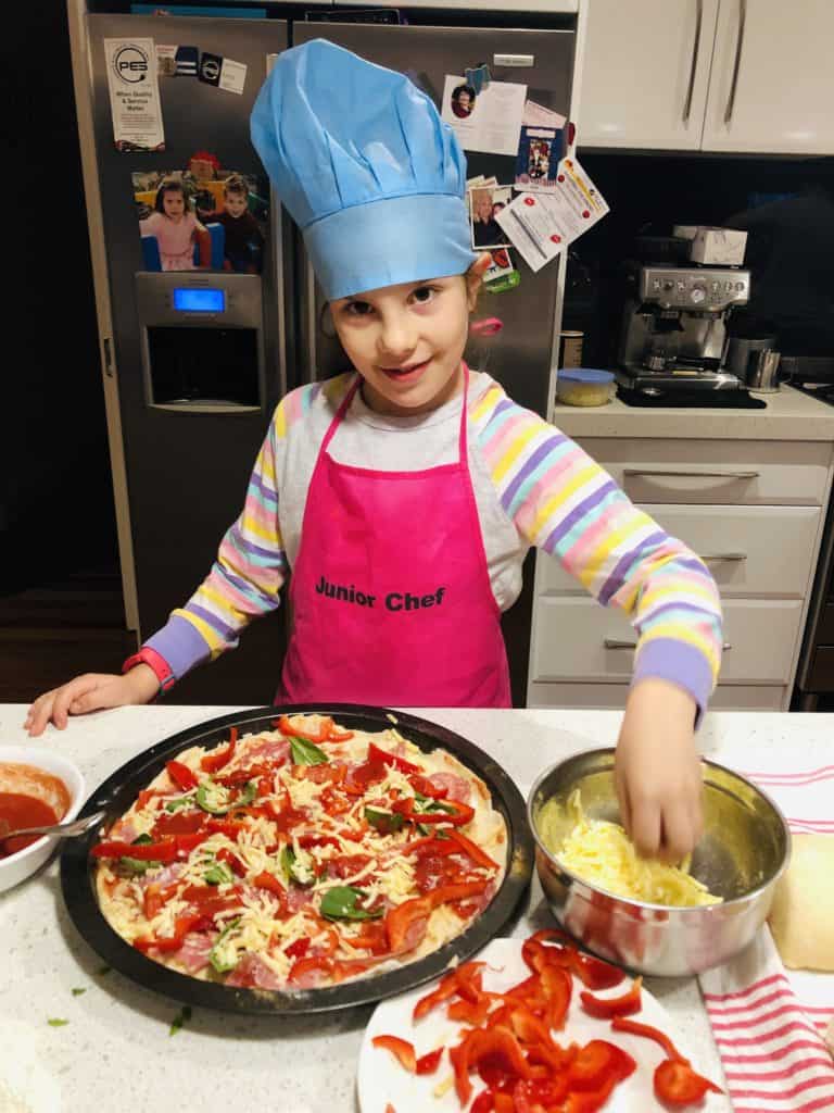 getting the kids involved in making pizzas