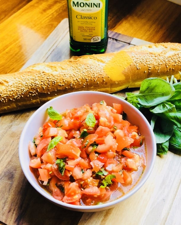 delicious Italian bruschetta with sweet tomatoes and fresh basil